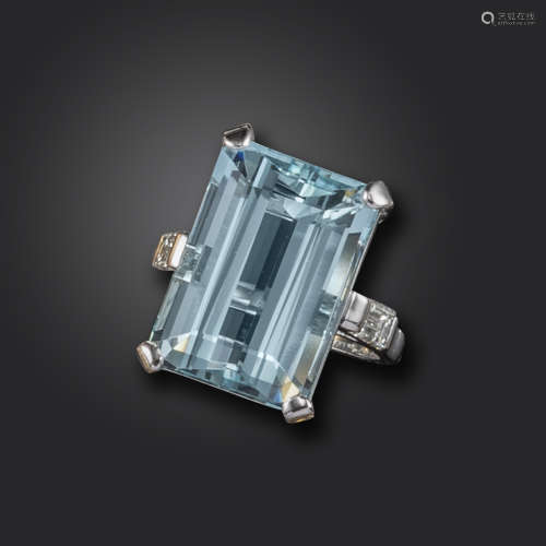 An aquamarine and diamond ring, set with an emerald-cut aquamarine weighing approximately 15.