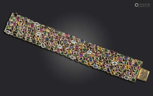 A gem-set gold bracelet, set with round brilliant-cut diamonds, square-shaped emeralds and various
