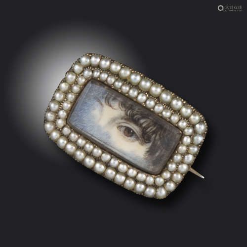 A mid 19th century eye miniature brooch, the rectangular eye miniature set within borders of seed