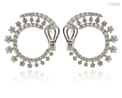 A pair of diamond hoop earrings, set with graduated round brilliant-cut diamonds weighing