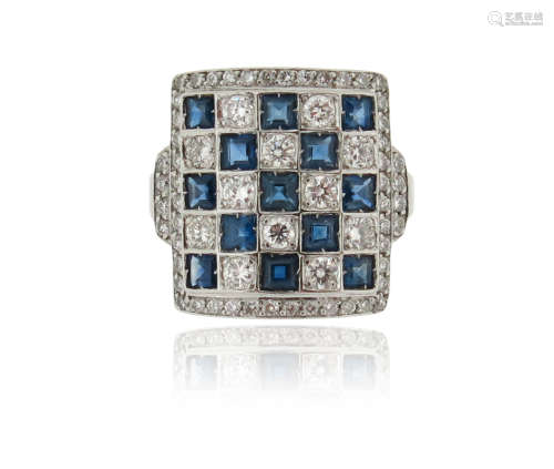 A sapphire and diamond chequerboard ring, set with calibre-cut sapphires and circular-cut diamonds