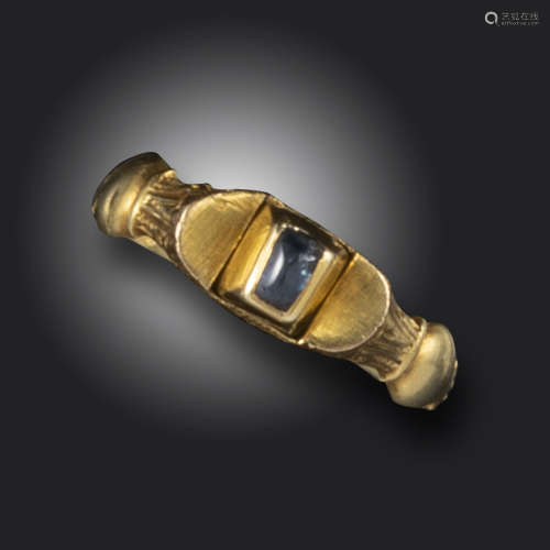 A Renaissance gold poison ring, mounted with a cabochon sapphire concealing a hidden compartment,