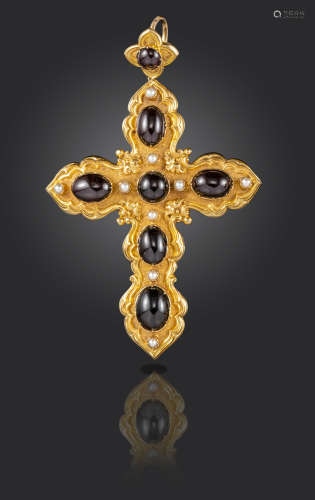 A Victorian garnet and seed pearl cross pendant, set with graduated garnet cabochons in repousse