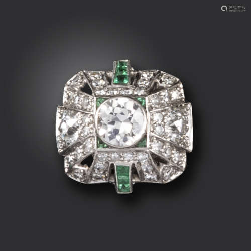 An emerald and diamond pyramidal cluster ring, set with graduated circular-cut diamonds and emeralds
