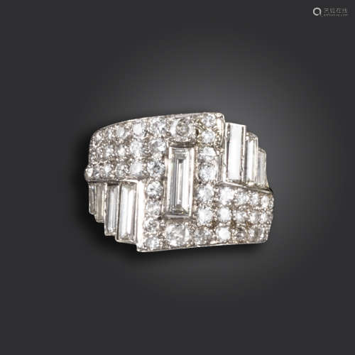 An Art Deco diamond ring, of geometric design, set with baguette-shaped and circular-cut diamonds in
