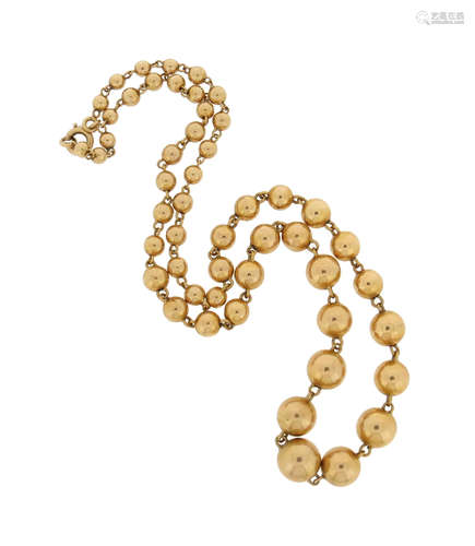 A yellow gold bead necklace, the spherical gold beads graduate from 3.9 - 9.7mm, 46cm long, 23g