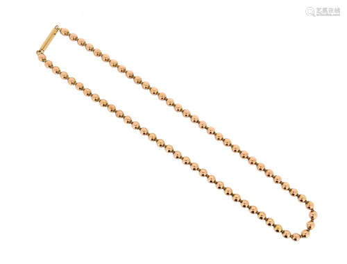 A gold bead necklace, the spherical links set on flexible neck chain, 42cm long, 30g