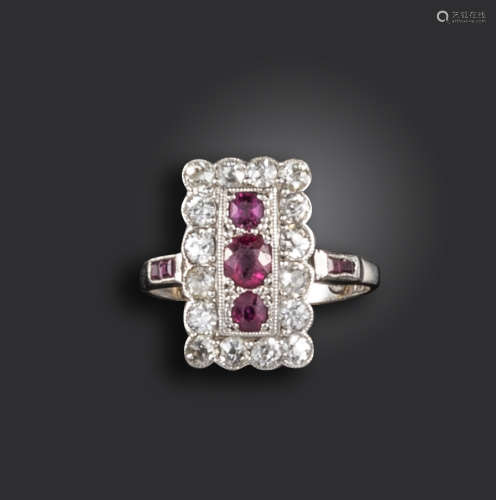 An Edwardian ruby and diamond plaque ring, of rectangular form, centred with three graduated