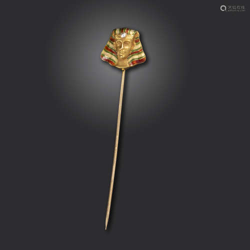 A 19th century Egyptian Revival Pharaoh's head gold stick pin, realistically formed with red and