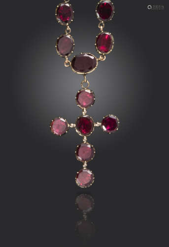 A George III garnet rivière necklace, the graduated oval-shaped garnets are set in closed back