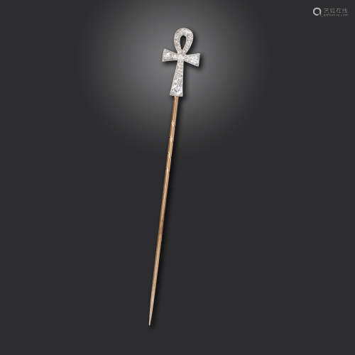 An early 20th century Egyptian Revival ankh stick pin, millegrain-set with graduated old circular-