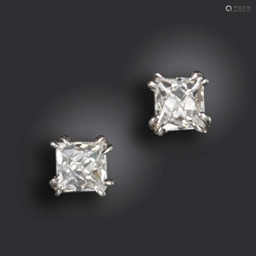 A pair of diamond stud earrings, the French-cut diamonds weigh approximately 1.40cts total, claw-set