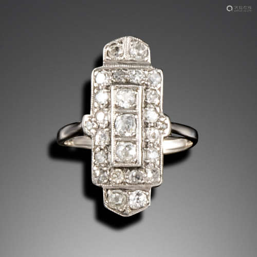 An Art Deco diamond plaque ring, set with graduated old cushion-shaped diamonds in white gold,