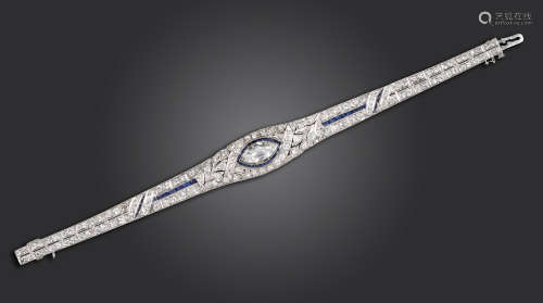 A diamond and sapphire bracelet, centred with a marquise-shaped diamond weighing approximately 2.