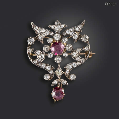 A Victorian ruby and diamond brooch, set with cushion-shaped rubies and diamonds in silver and gold,