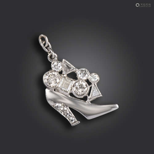 A diamond charm pendant, the high heeled shoe set with assorted diamonds in platinum, 1.8cm high