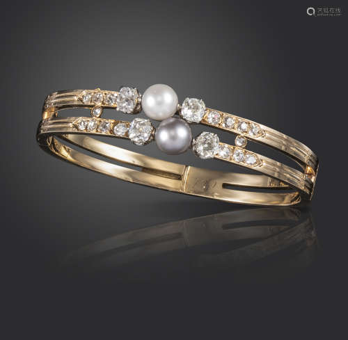 A 19th century French natural pearl and diamond bangle, set with a white pearl and a grey natural