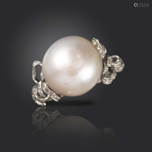 A natural pearl and diamond ring, the stylised bow shoulders set with rose-cut diamonds in platinum,