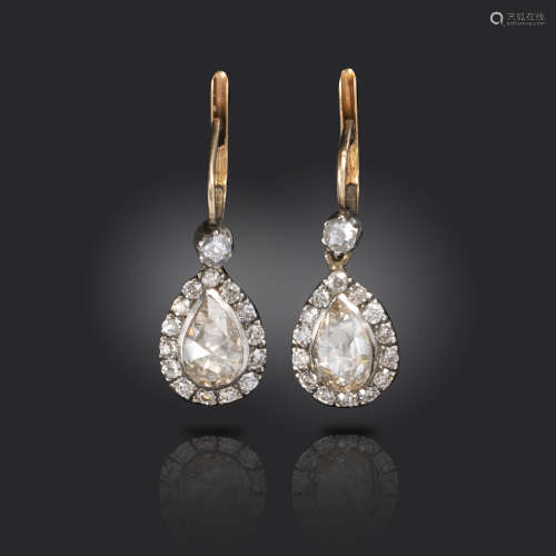A pair of rose-cut diamond earrings, set with pear-shaped rose-cut diamonds within a surround of old