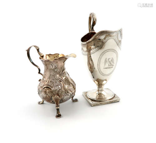 A George III silver cream jug, by Robert Hennell, London 1792, helmet form, engraved decoration,