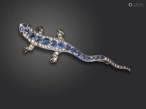 A Victorian gem-set lizard brooch, set with oval-shaped sapphires, seed pearls and ruby eyes in