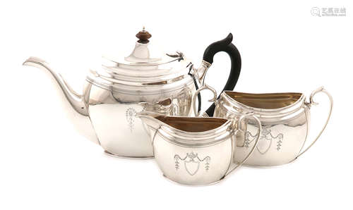 A three-piece silver tea set, by The Barnards, London 1905 and 1906, oval form, scroll handles,