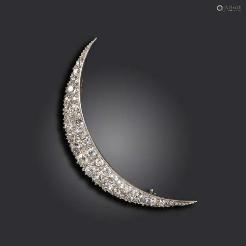 A late 19th century diamond-set open crescent brooch, set with two rows of graduated old circular-