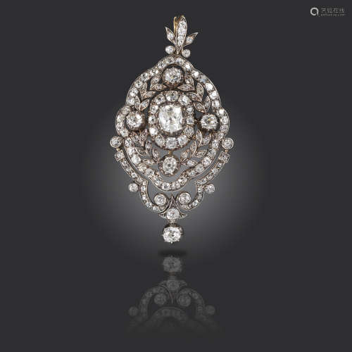 A late Victorian diamond pendant brooch, centred with an old cushion-shaped diamond weighing