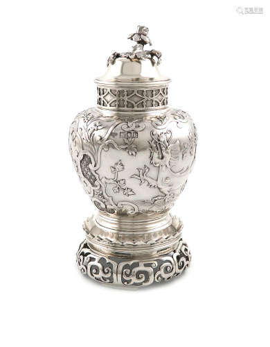 A late-Victorian silver tea caddy and stand, by the Goldsmiths and Silversmiths Company, London