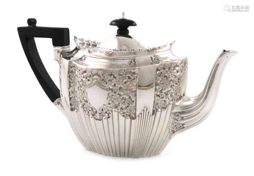 A late-Victorian silver teapot, by James Dixon and Sons, Sheffield 1895, shaped oval form, chased