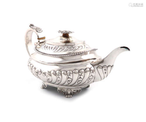 λA George IV silver teapot, by Thomas Death, London 1824, oblong bellied form, part-fluted and