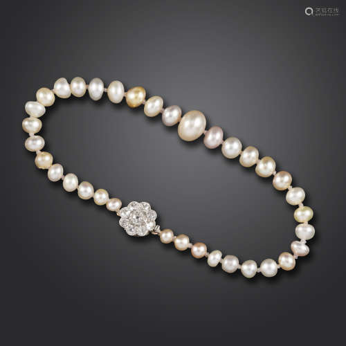A single-row natural pearl bracelet, the graduated natural pearls set with a diamond cluster