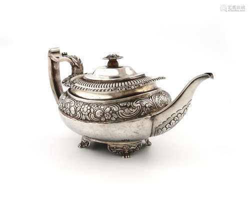 λA George III silver teapot, by Crispin Fuller, London 1817, oblong bellied form, with a band of