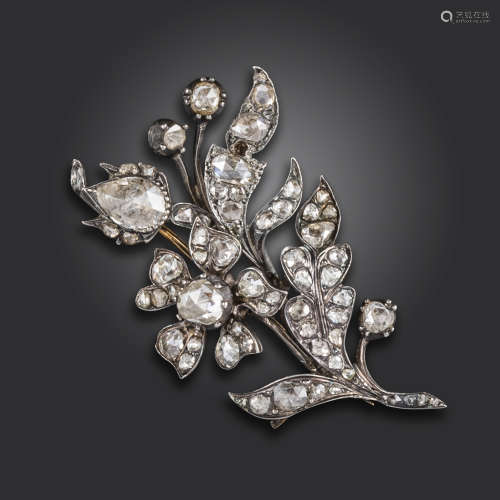 An early 19th century diamond-set foliate brooch, the floral spray set overall with graduated rose-
