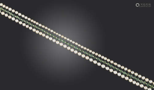 A three-row pearl and emerald necklace, set with two rows of graduated pearls and a single row of