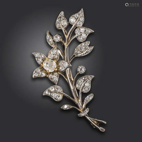 A late Victorian diamond-set foliate brooch, the principal diamond flower head set with an old