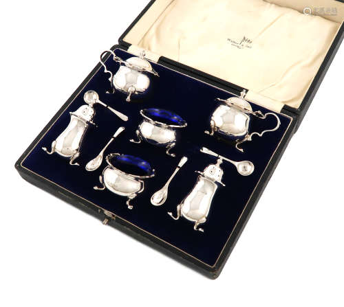 A six-piece silver condiment set, by Walker and Hall, Birmingham 1932, circular bellied form, wavy-