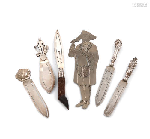 A collection of six page markers, comprising silver items: one with a pistol-grip handle, Birmingham