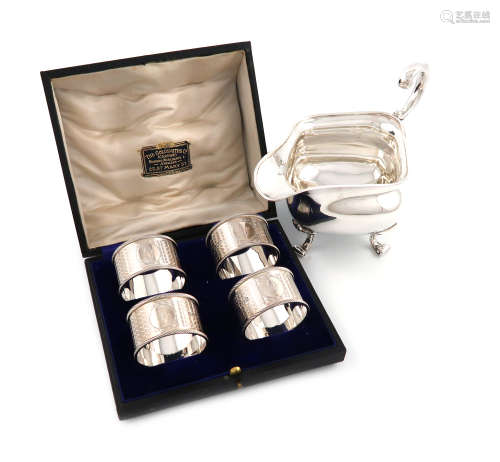 A cased set of four silver napkin rings, by Martin, Hall and Co, Sheffield 1918, retailed by The