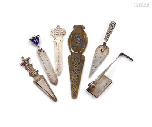 A collection of six page markers, comprising silver item, an Asprey sprung-action page marker,