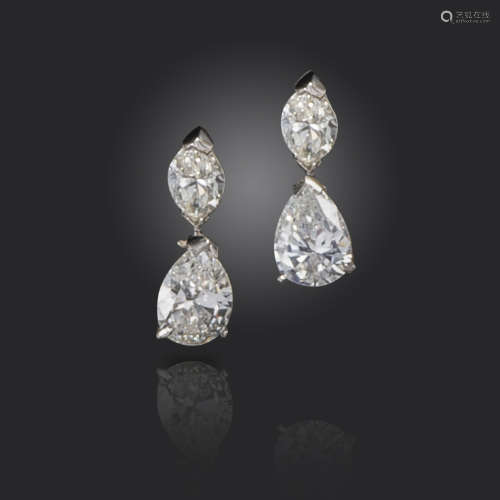 A pair of diamond drop earrings, set with marquise-shaped diamonds and suspending pear-shaped