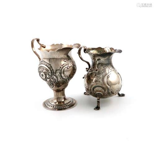 A George II silver cream jug, by Phillip Goddard, London 1743, baluster form, leaf capped scroll