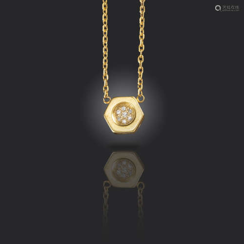 A diamond-set gold pendant by Cartier, designed as a hexagonal bolt finial, pave-set to the centre
