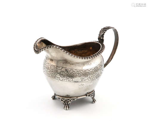 A George III silver cream jug, by Jonathan Hayne, London 1826, oval form, leaf capped scroll handle,