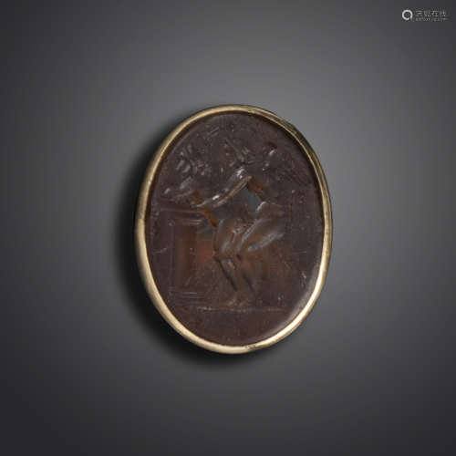 A 19th century erotic glass intaglio, depicting a winged adult Cupid in a passionate embrace, within