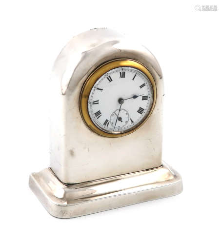 A silver clock, by James Deakin and Sons, Chester 1913, plain arched form, on a shaped rectangular
