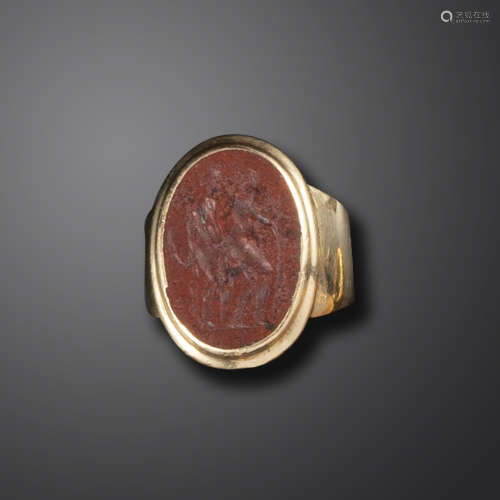 An 18th century erotic jasper intaglio ring, depicting a couple in the midst of a passionate