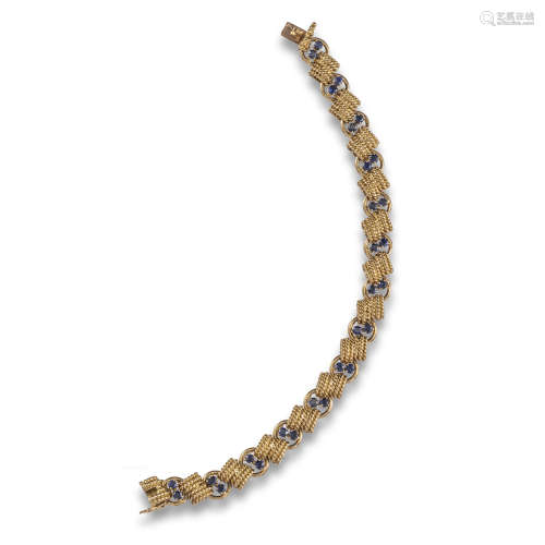 A sapphire and gold bracelet by Van Cleef & Arpels, the pairs of sapphires separated with twisted