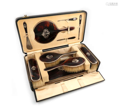 λA silver and tortoiseshell dressing table set, by The Barker Brothers, Birmingham 1940. the