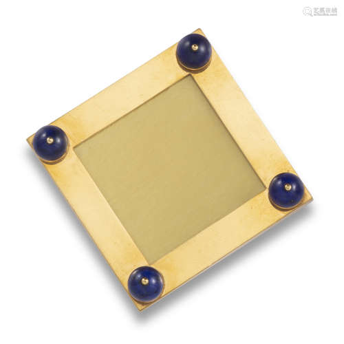 A yellow gold square frame by Boucheron, mounted with four lapis lazuli beads, with hinged gold